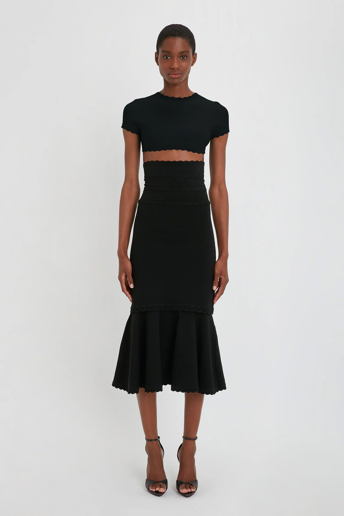 VictoriaBeckham_FlaredSkirtInBlack_BLACK_1223KSK004554A_2700_4050_247_WHITE_LR_HR_Front_Model1_JPG2_1500x